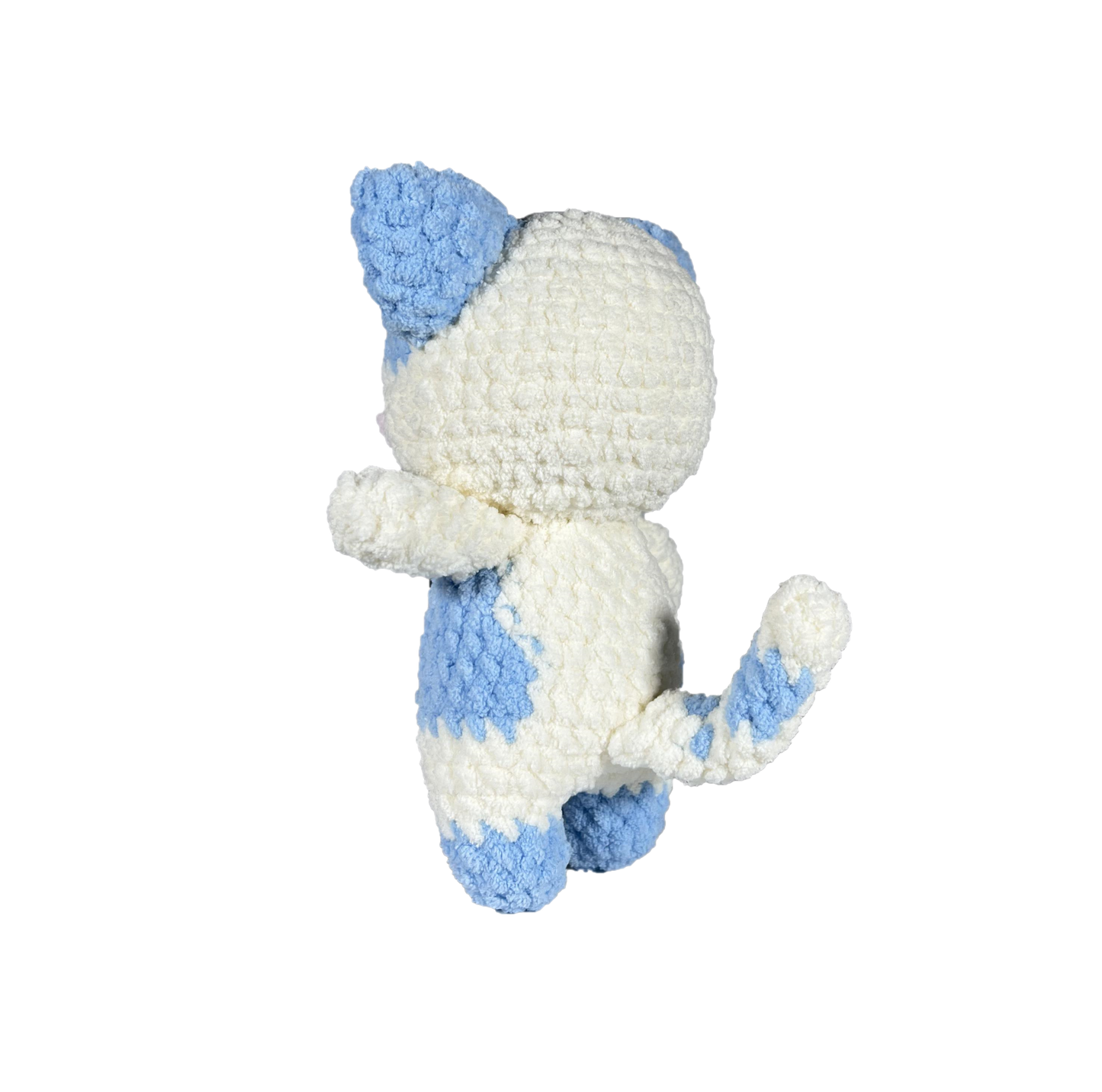 Blue and white crochet cat standing on 2 legs facing to the side.