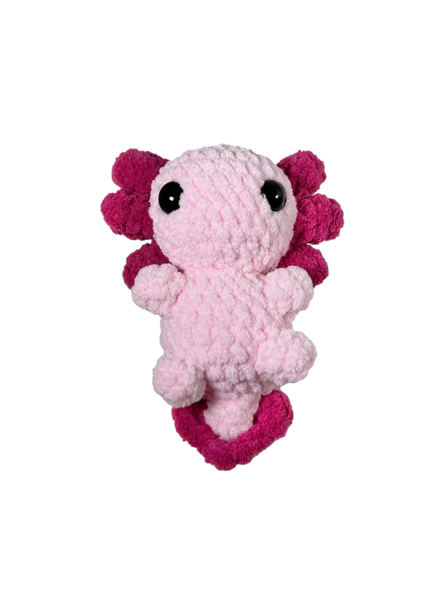 Pink crochet axolotl with white background.