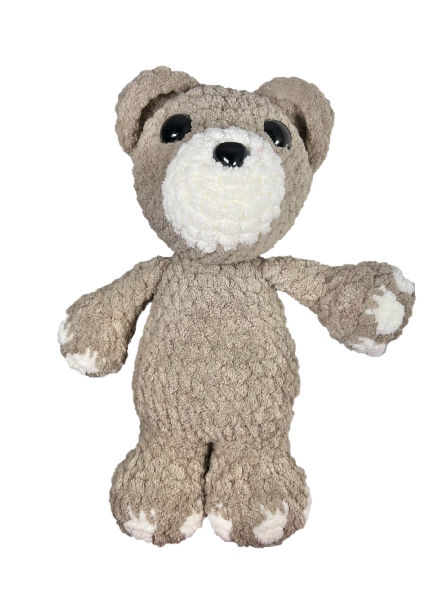 Brown crochet bear standing.