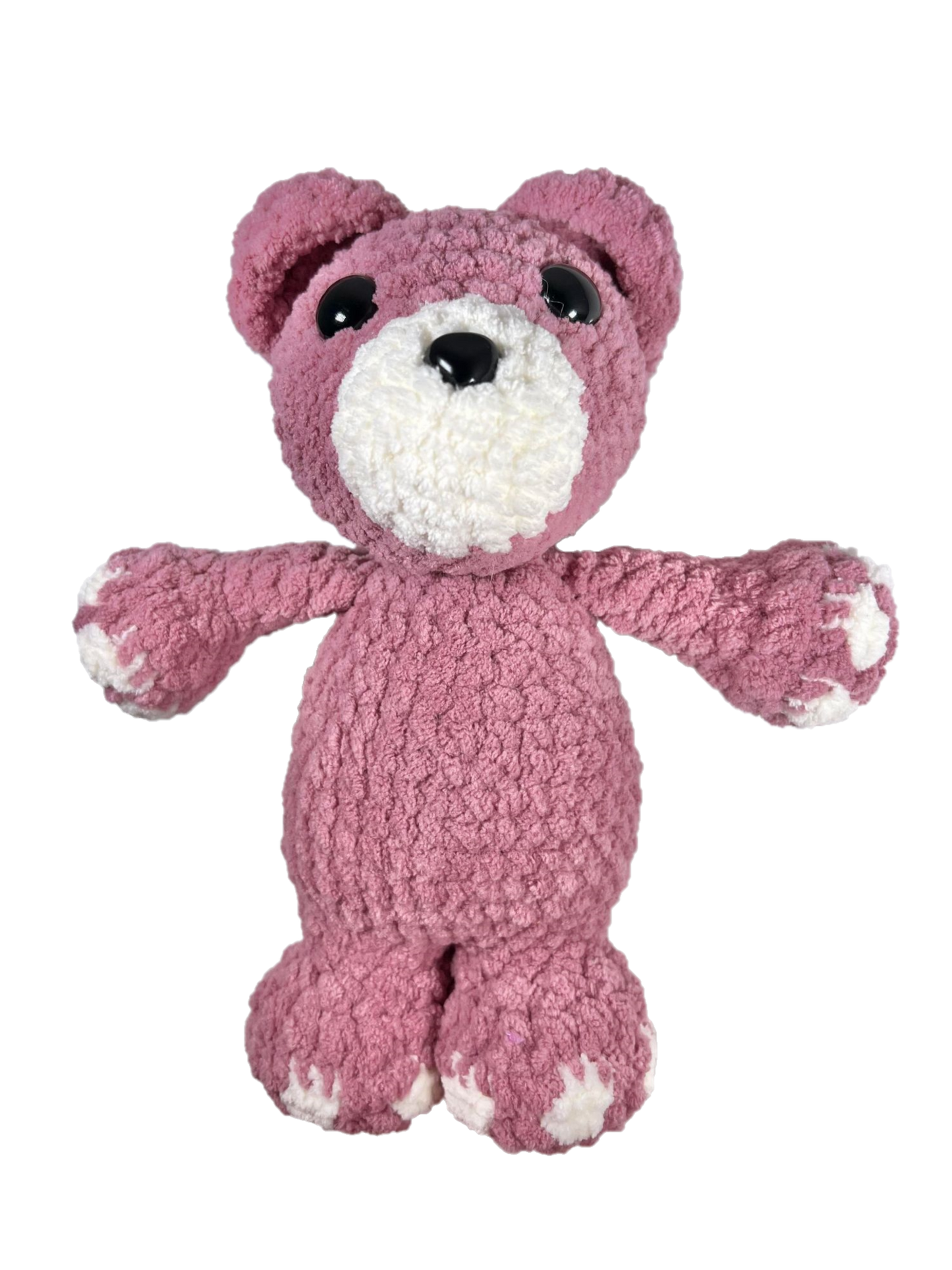 Pink crochet bear standing.