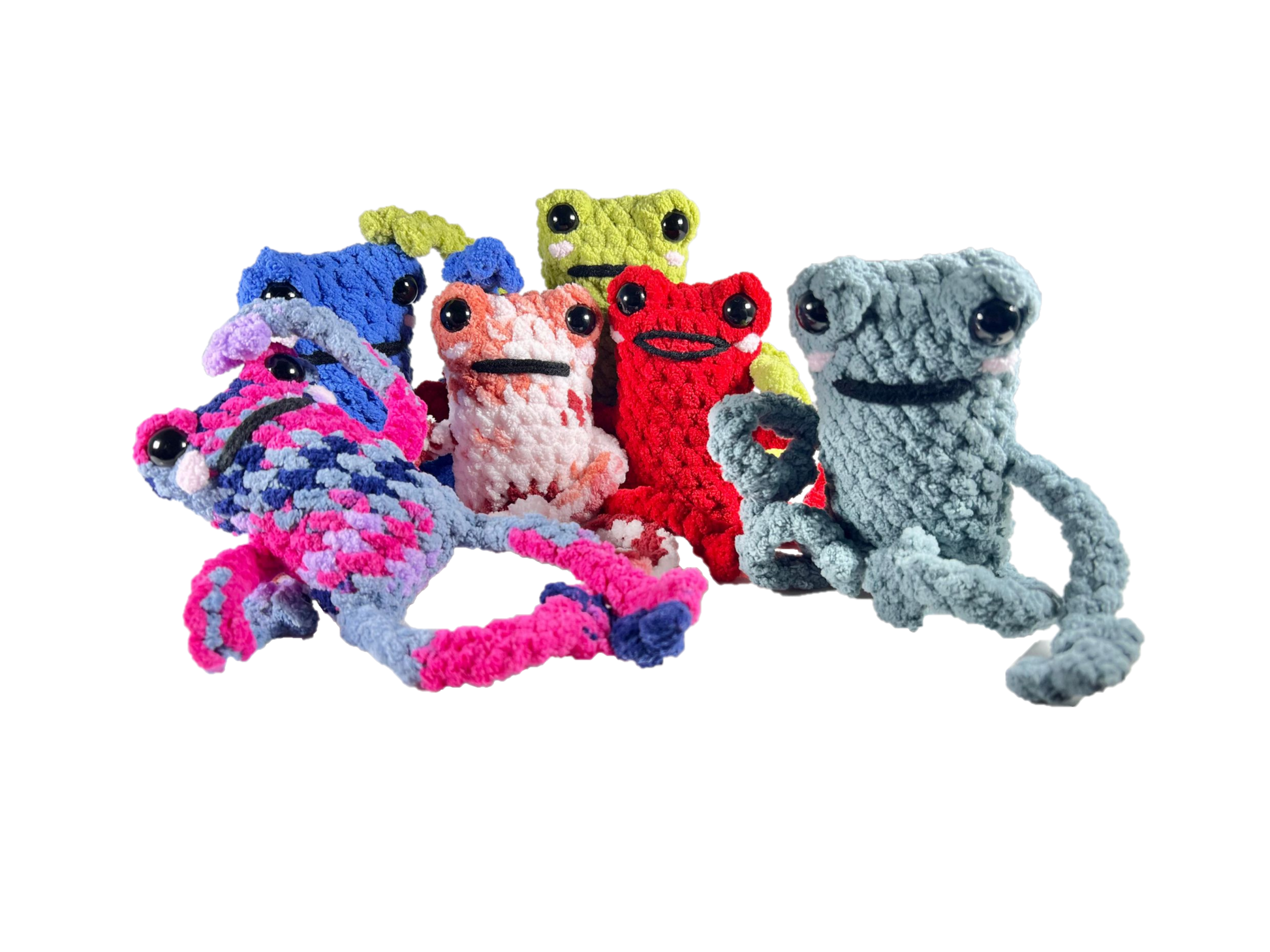 Family of crochet frogs in various colors all in funny poses looking ahead.