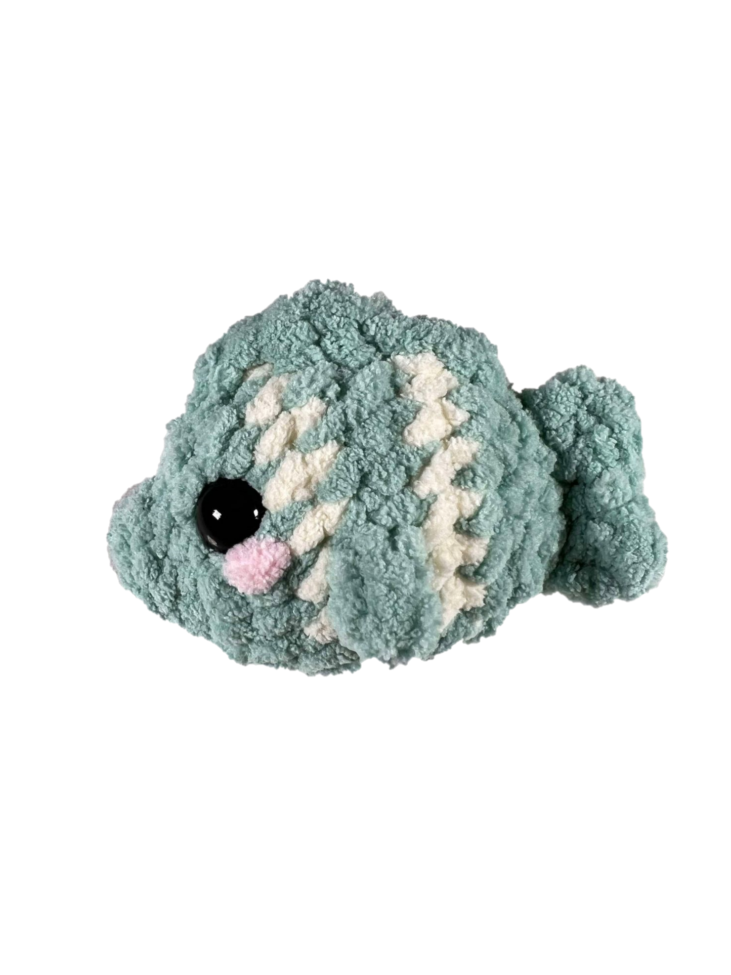 Green crochet fish plushie with 2 white stripes facing left.