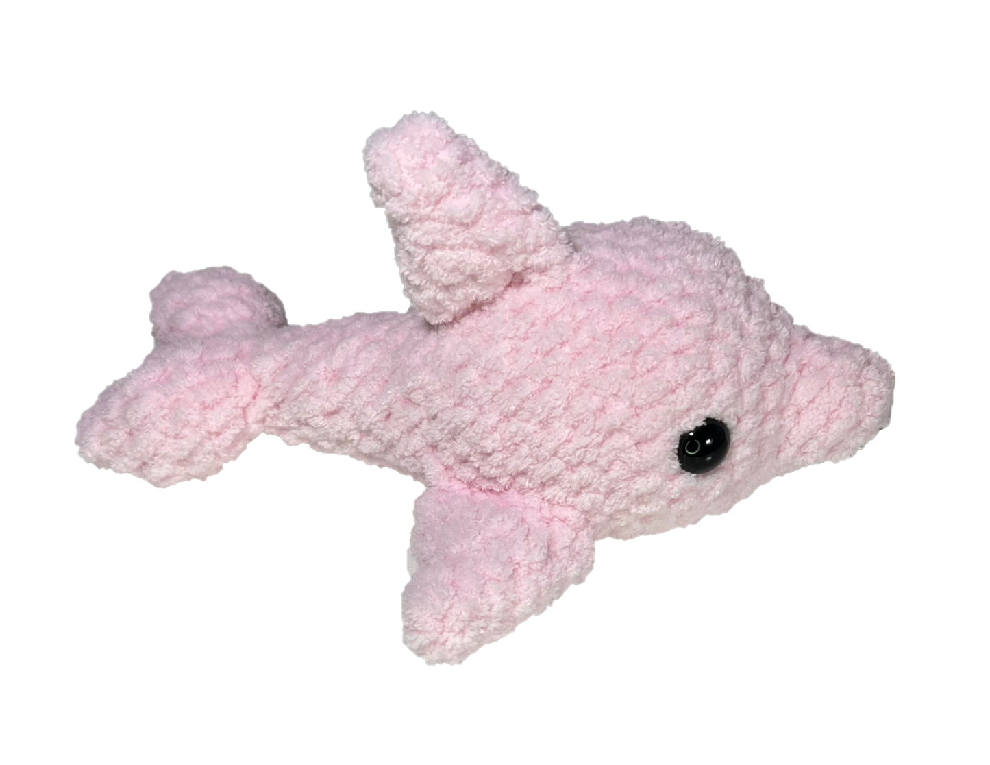 Pink crochet dolphin looking to the right.