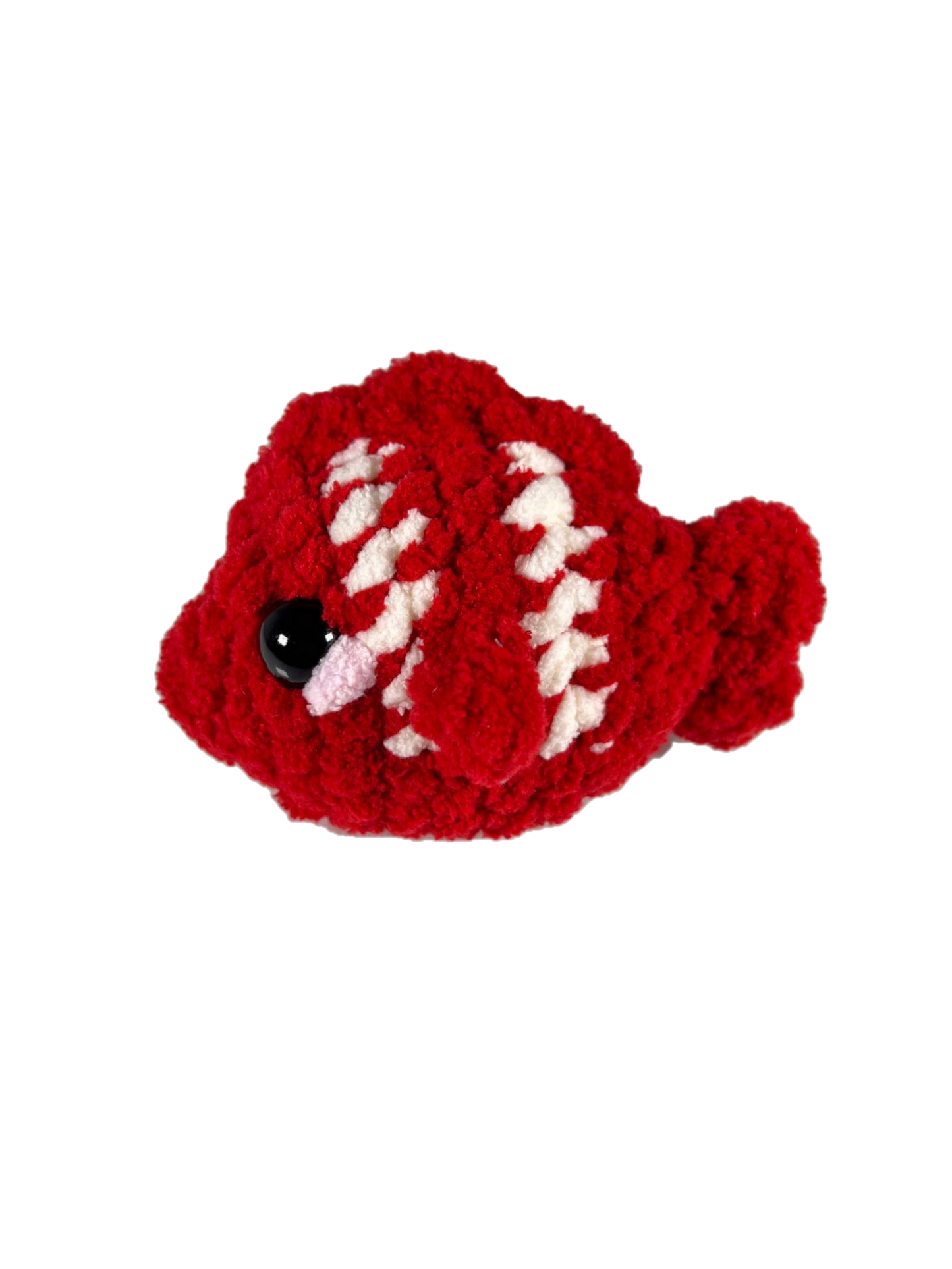 Red crochet fish plushie with 2 white stripes facing left.