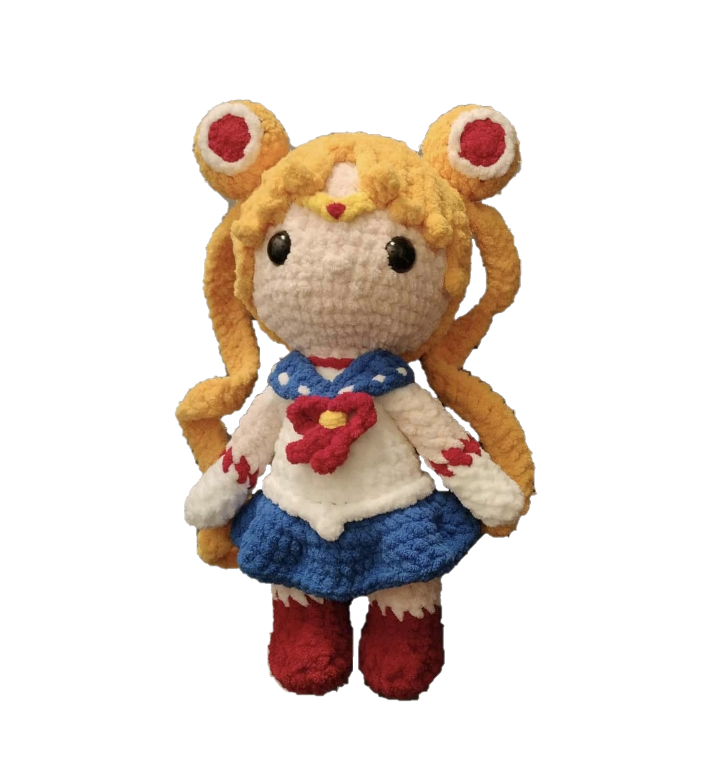 Crocheted plush toy of a character with blonde hair and red eyes on a white background