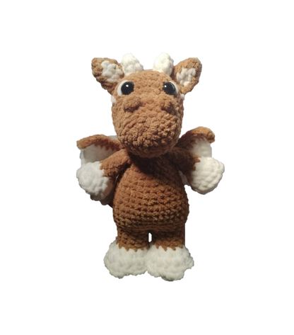 Crocheted toy brown dragon on a white background