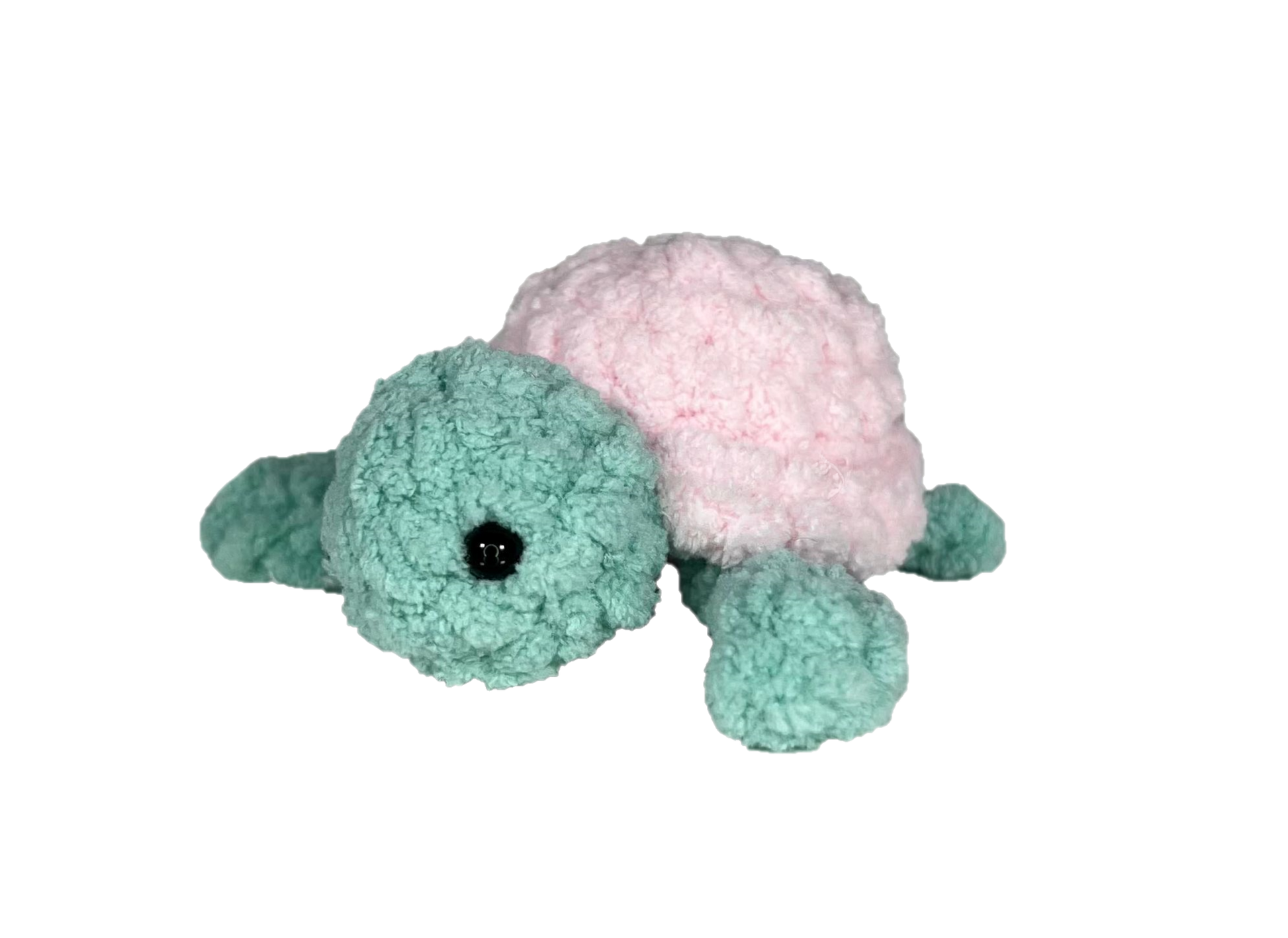 Green crochet turtle with a pink shell.