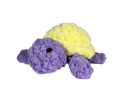 Purple crochet turtle with a yellow shell.