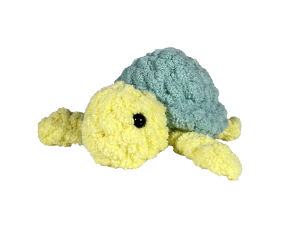 Yellow crochet turtle with a green shell.